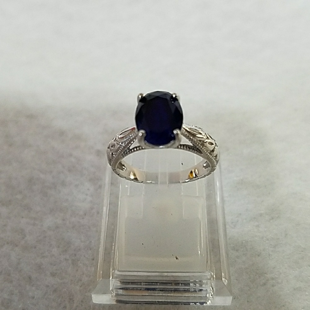 Pre-owned vintage style lab created sapphire ring.